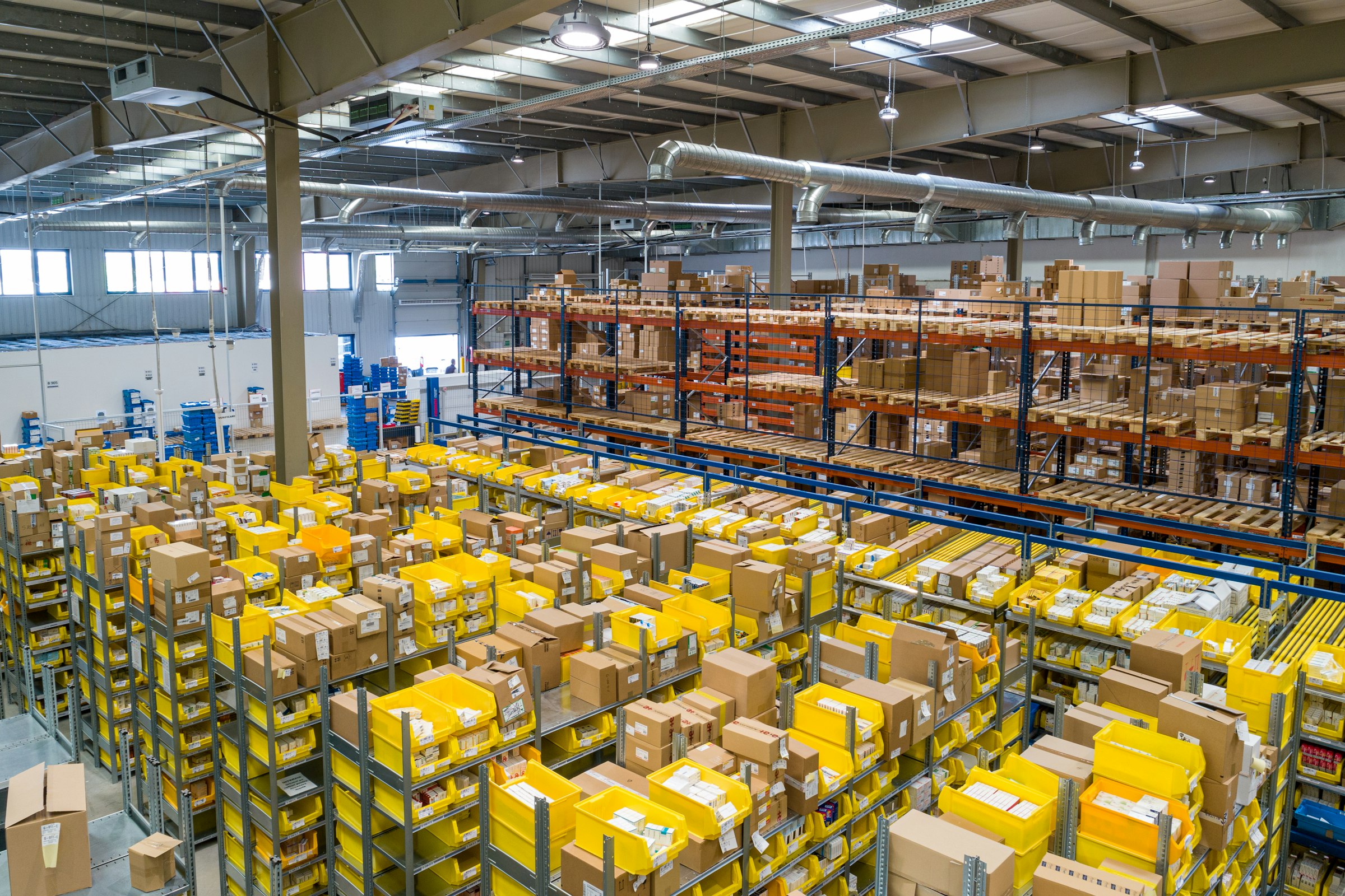 Distribution warehouse interior with organized inventory shelves